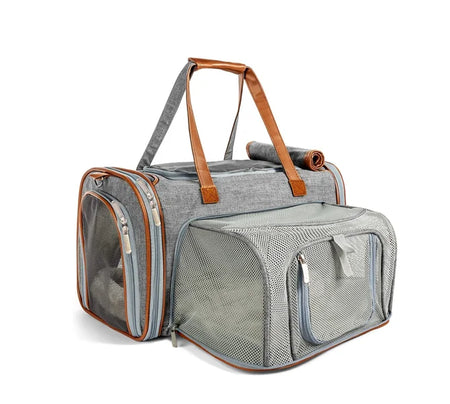 Gray pet carrier with brown handles on a white background