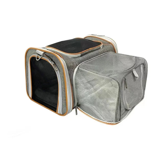 Pet carrier with mesh side and black interior on a white background