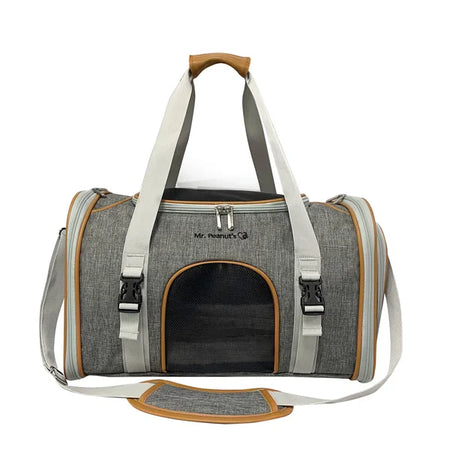 Gray pet carrier with white straps and brown accents on a white background