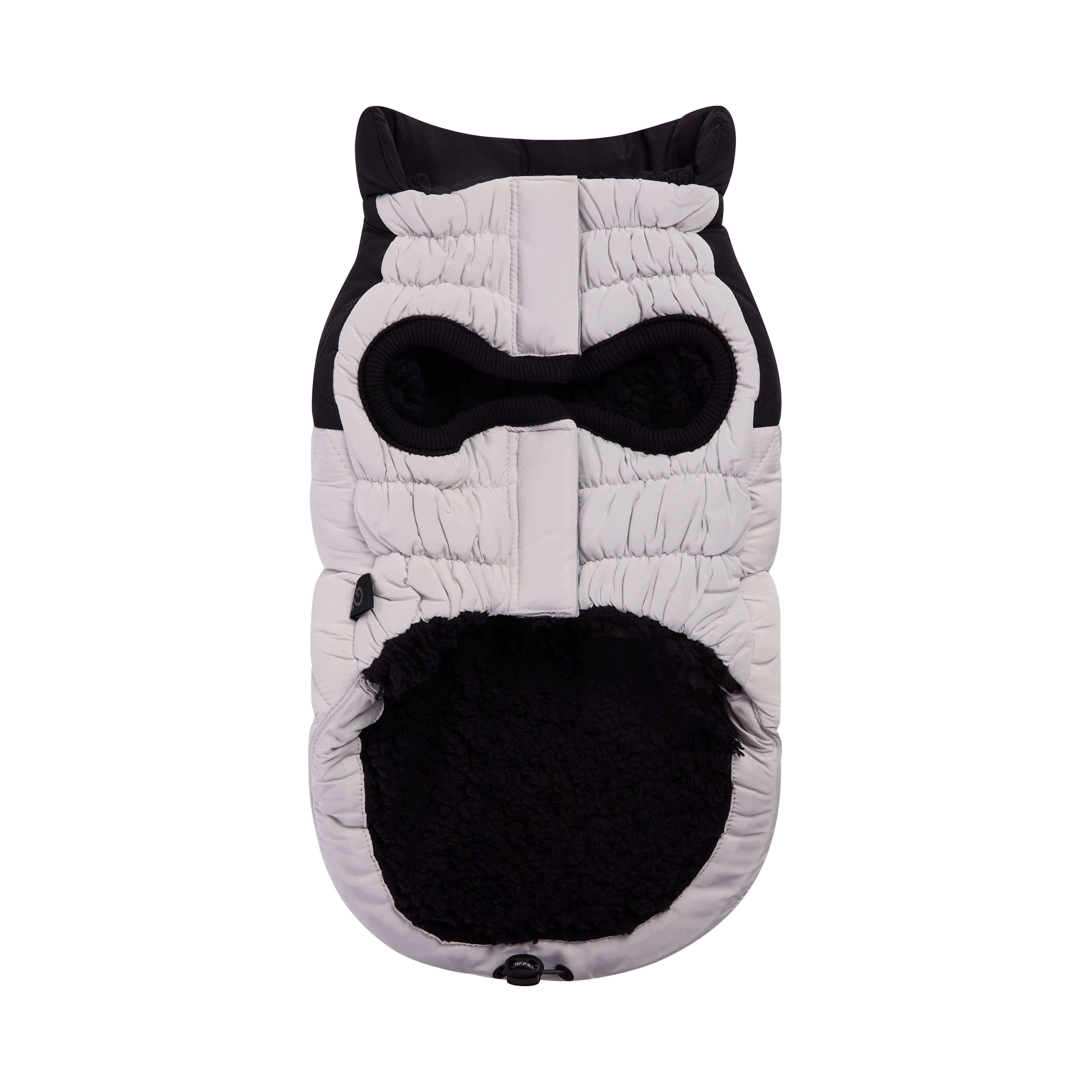 Quilted dog coat shaped like an owl with black and white design on a white background