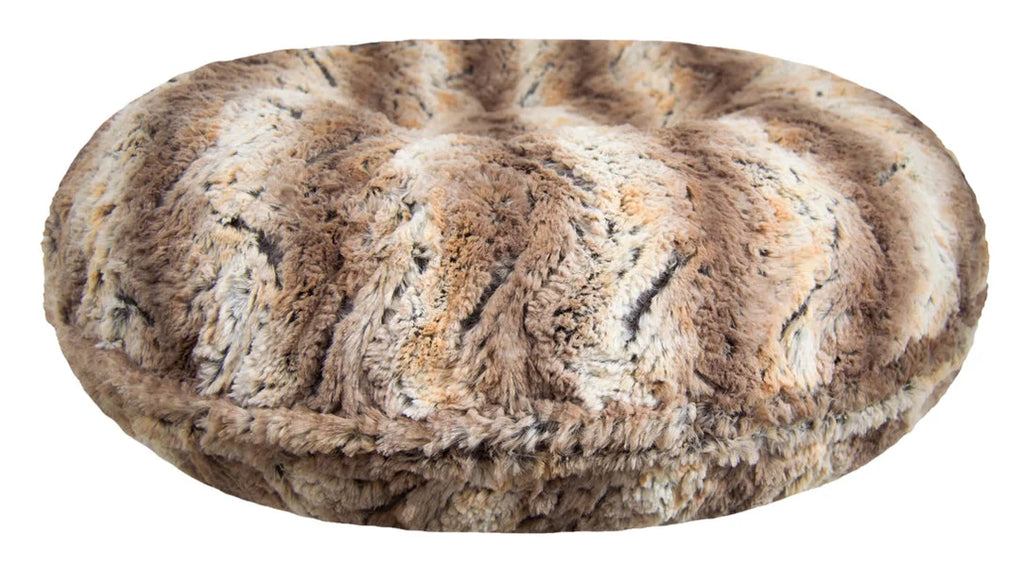 Round stone with textured surface on a white background
