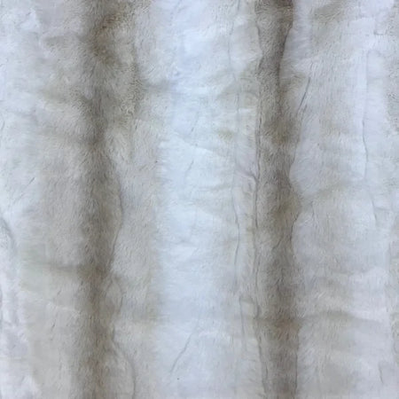 Close-up of textured white fabric with subtle variations in color.