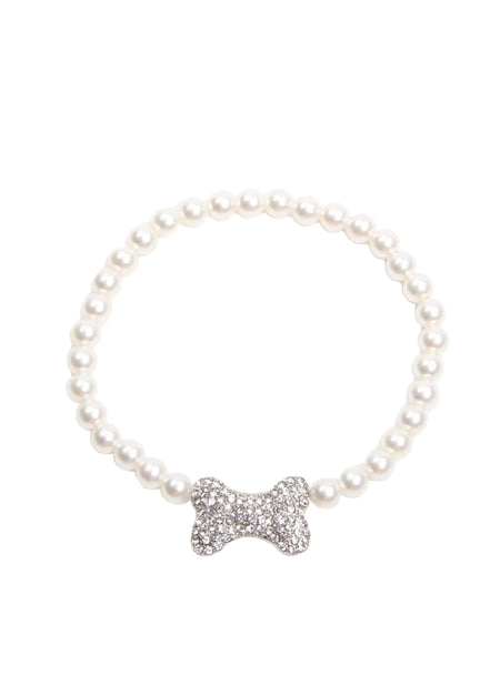 Pearl bracelet with a silver bone-shaped charm on a white background