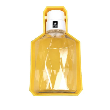 Clear bottle with white cap in a yellow holder on a white background