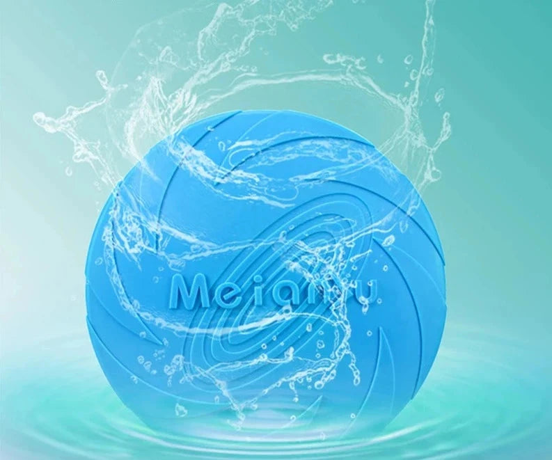 A Durable Silicone Dog Flying Disc – Sturdy, Bite-Resistant Outdoor Training Toy is shown against a turquoise gradient background. Splashes of water surround the disc, emphasizing its floating ability. Text above the disc reads, 