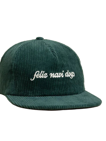 Green corduroy cap with white text on a beige background